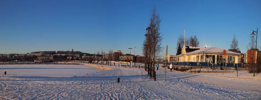 A frozen lake near Jyväskylä in winter, with snow and a low sun.